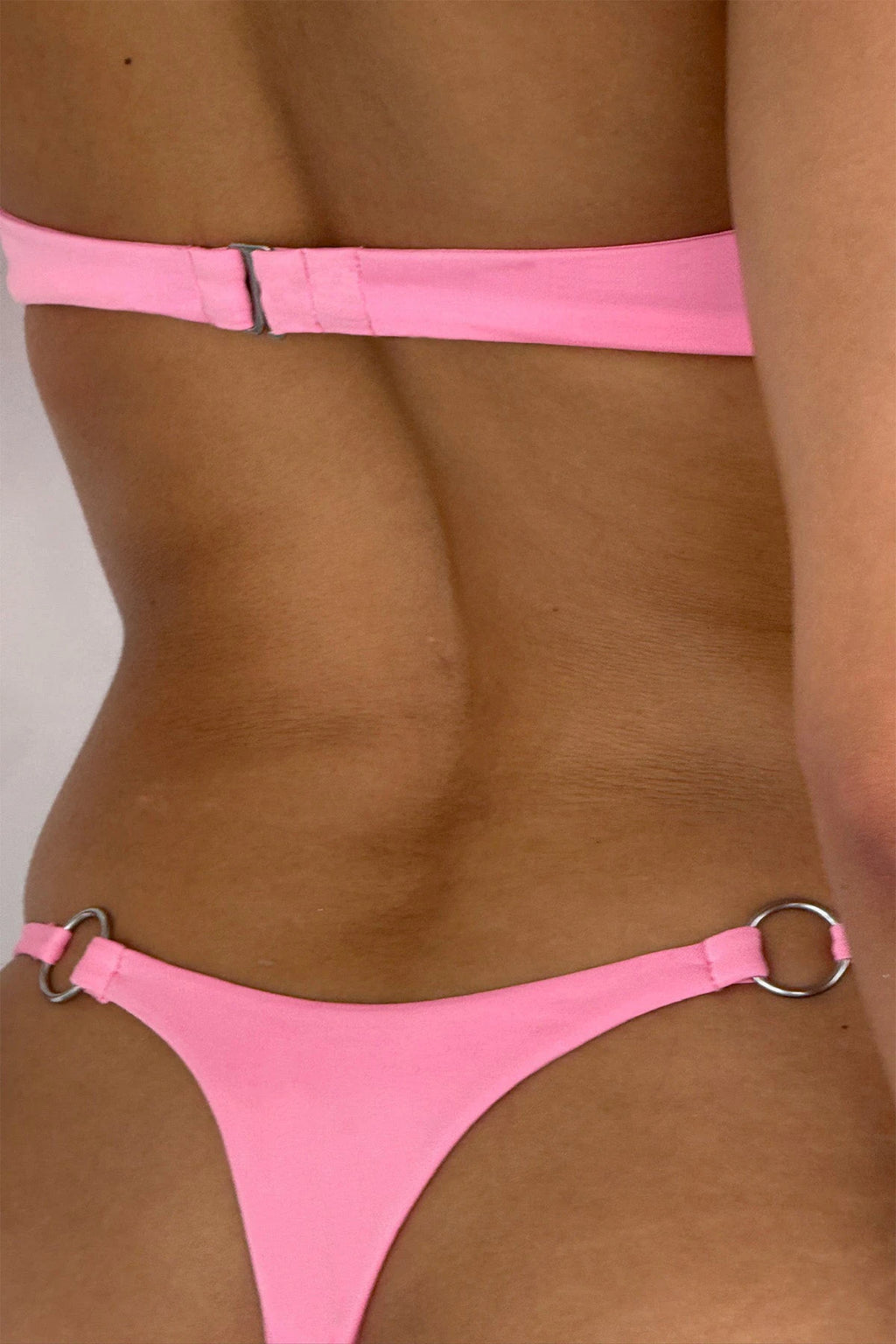 New Arrival: Solid-Color Strapless Micro Bikini Set—a sexy, bandeau-style swimsuit crafted from eco-friendly Repreve fabric, featuring a thong-style bottom for women.