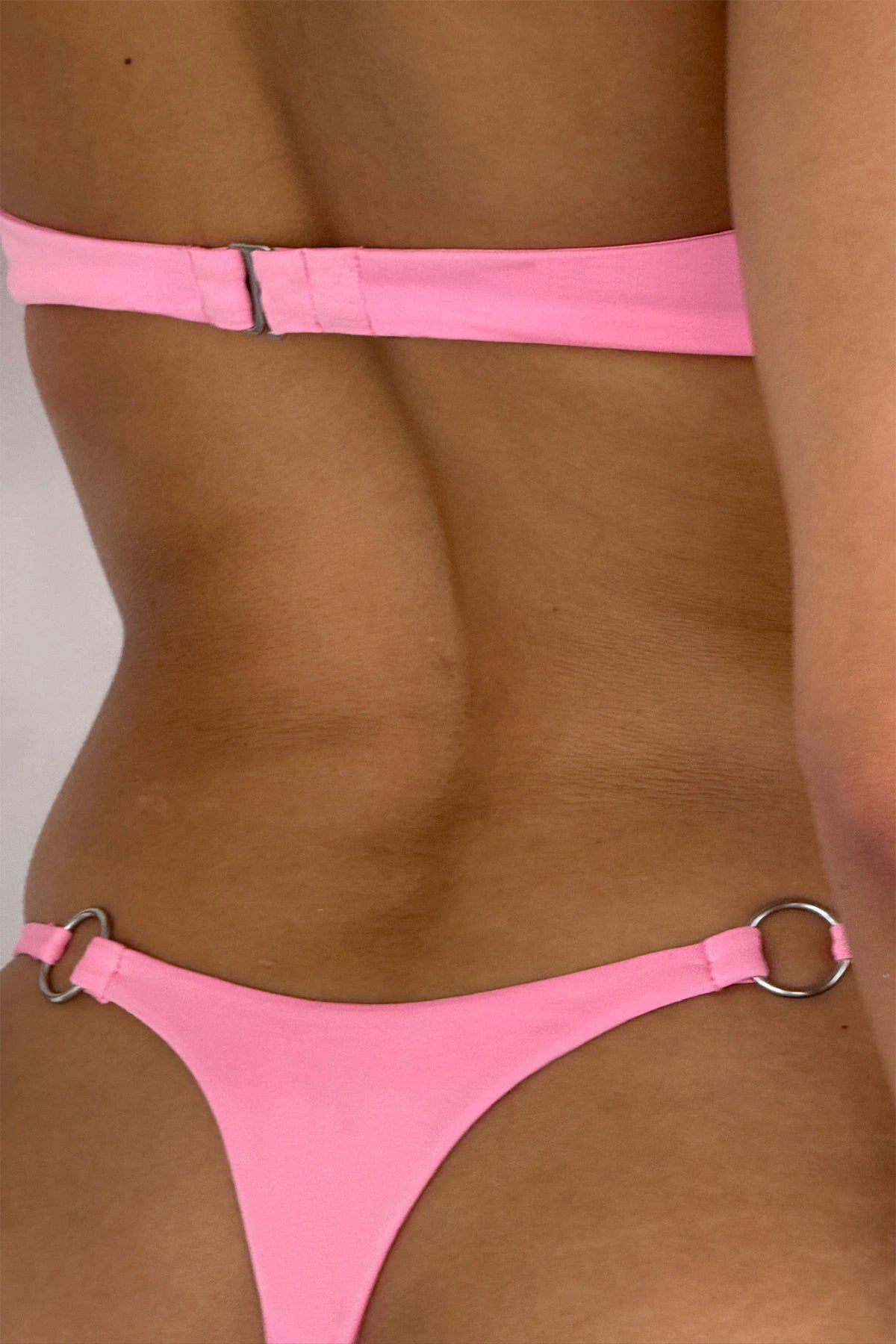 New Arrival: Solid-Color Strapless Micro Bikini Set—a sexy, bandeau-style swimsuit crafted from eco-friendly Repreve fabric, featuring a thong-style bottom for women.